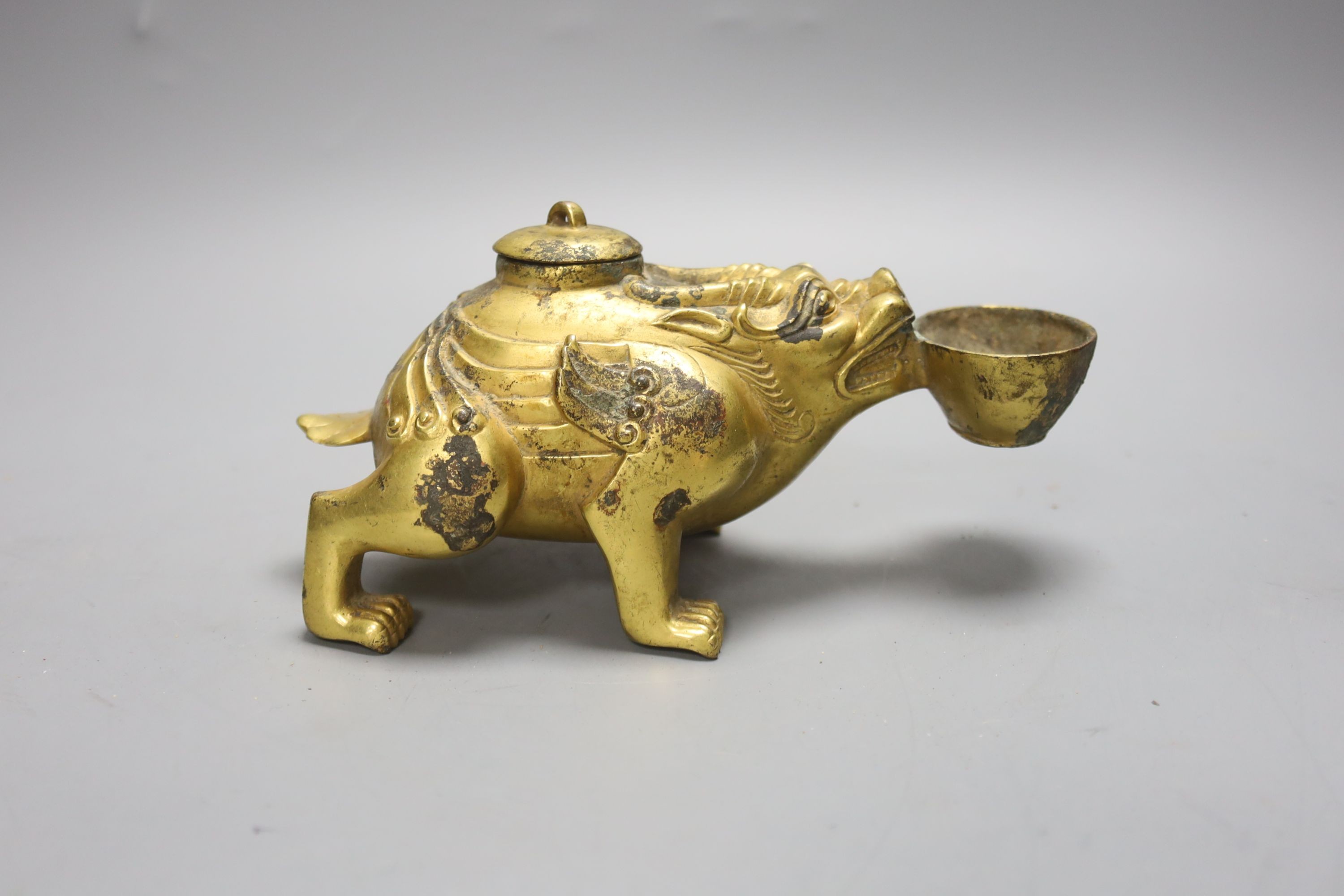 A Chinese gilt bronze mythical beast lamp, width 16cm